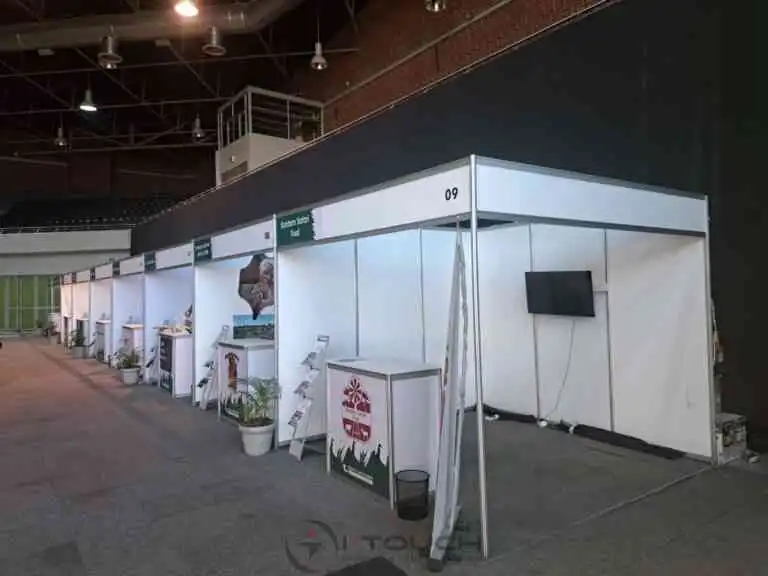 3m x 3m shell scheme booth with custom graphics and furniture