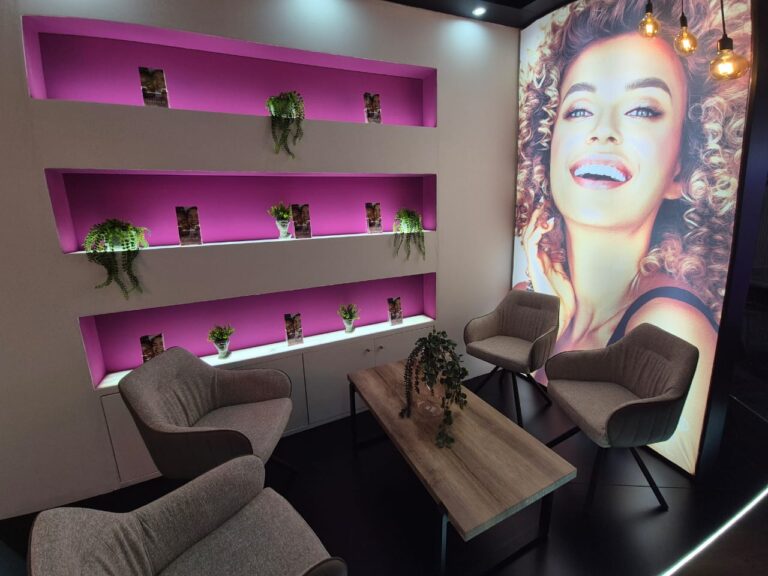 Illuminated product shelving and branding inside Rite Aid Health Care exhibition stand