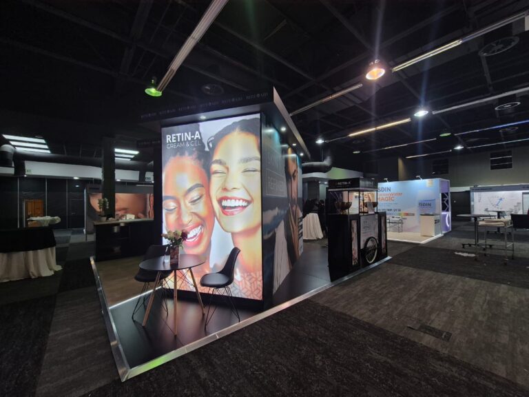 6x6m island exhibition stand for Rite Aid with backlit graphics and neon greenery wall